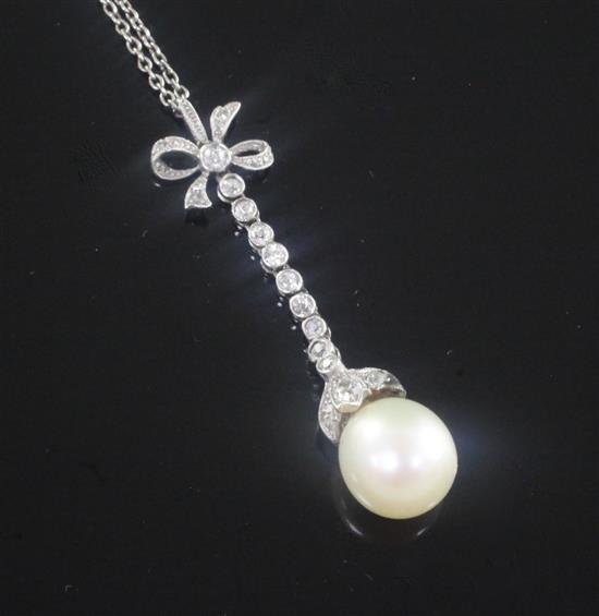 A 1920s platinum, diamond and cultured pearl set drop pendant, pendant 1.5in.